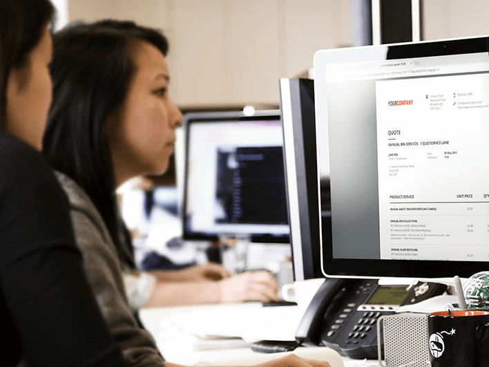 Person using large computer monitor for work